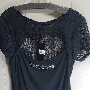 bebe top color black .